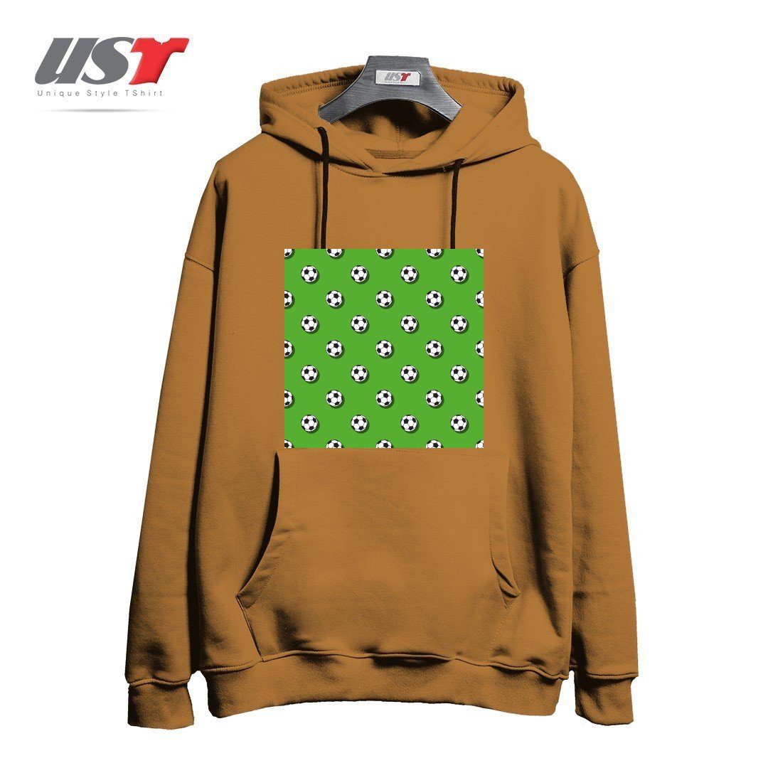 طرح WHITE CLASSIC BALL FOR SOCCER (FOOTBALL) PATTERN ON A GREEN BACKGROUND2 هودی اورسایزرنگ نسکافه ای