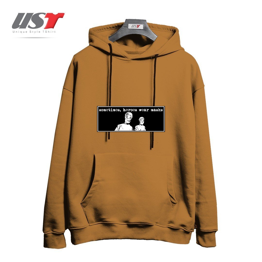 طرح SOMETIMES HEROES WEAR MASKS هودی اورسایزرنگ نسکافه ای